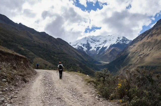 hikers-walking-towards-big-snowy-mountain-salkantay-andes-mountain-range (1)