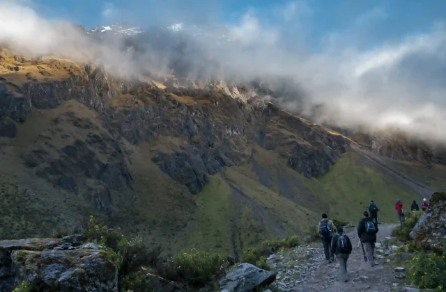 hikers-walking-towards-big-snowy-mountain-salkantay-andes-mountain-range (2)