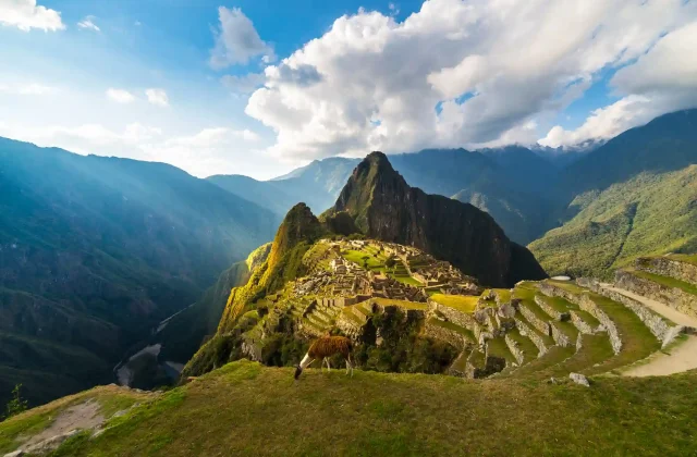 machu-picchu-illuminated-by-warm-sunset-light-wide-angle-view-from-terraces-with-scenic-sky-sun-burst_20211114_161549